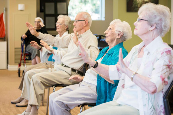 Seniors enjoying with each other at Oakville Retirement Residence