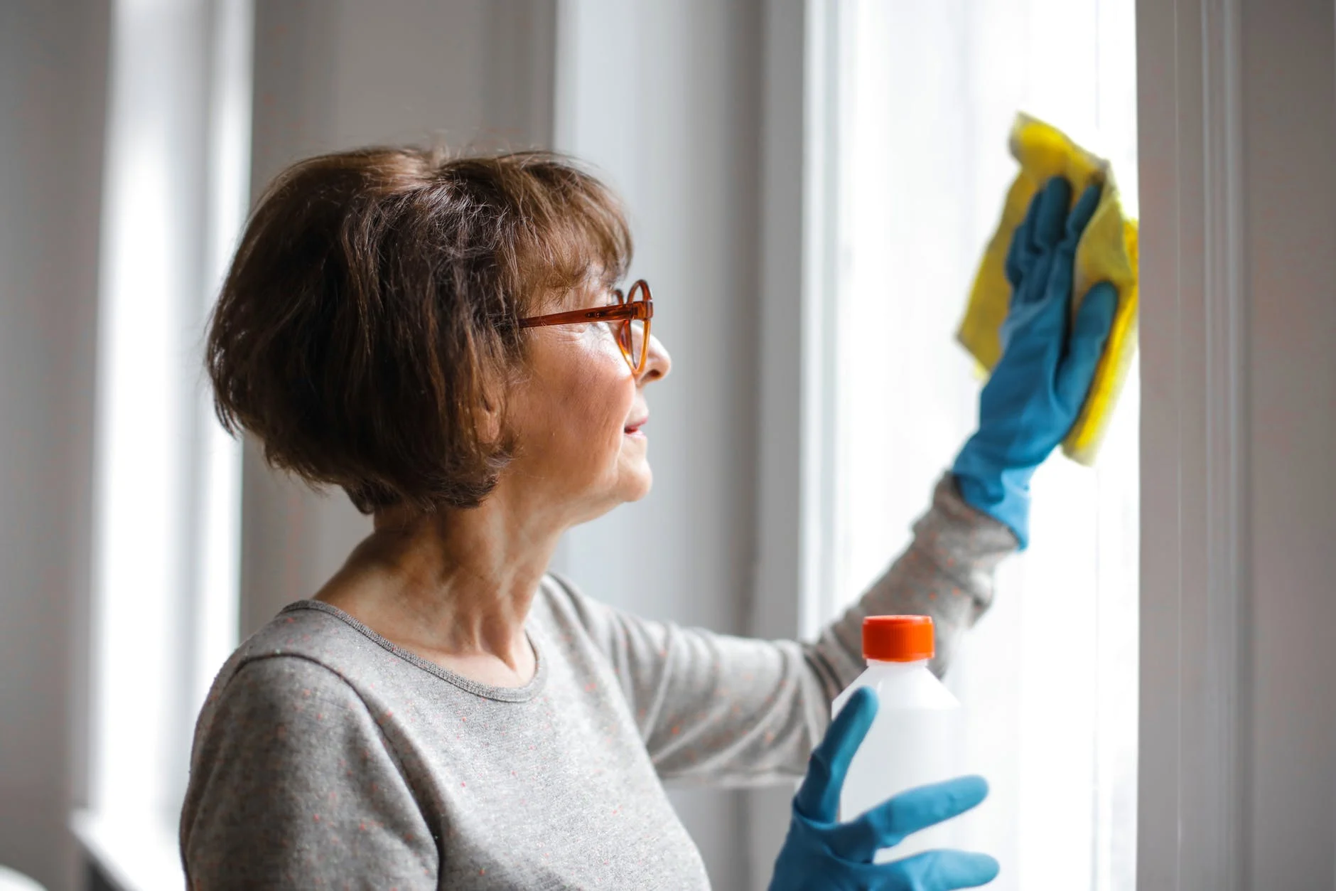 A Senior Deep Cleaning her Home